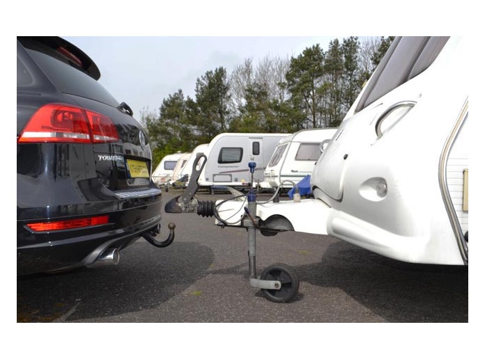 Close-up of trailer maintenance tools in use